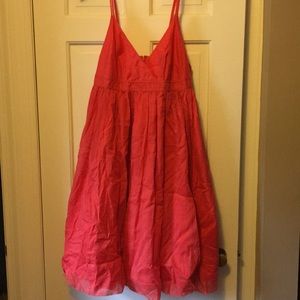 Pretty salmon-hued party dress.